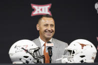 Texas head coach Steve Sarkisian smiles before speaking to reporters at the NCAA college football Big 12 media days in Arlington, Texas, Thursday, July 14, 2022. (AP Photo/LM Otero)