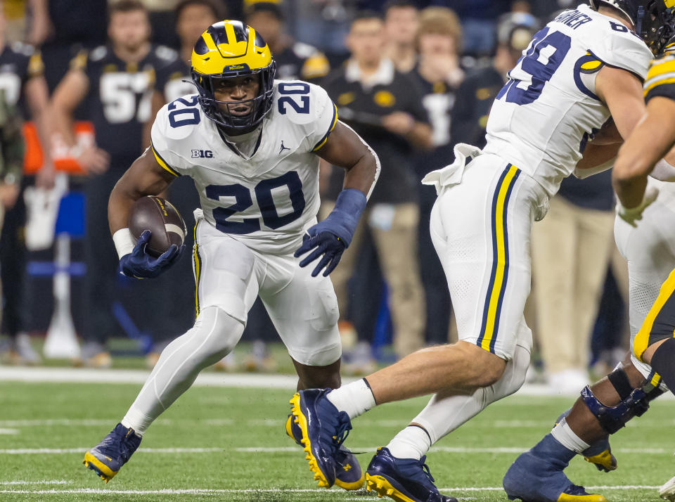 INDIANAPOLIS, INDIANA - DECEMBER 2: Kalel Mullings #20 of the Michigan Wolverines runs with the ball against the Iowa Hawkeyes during the Big Ten Championship at Lucas Oil Stadium on December 2, 2023 in Indianapolis, Indiana. (Photo by Michael Hickey/Getty Images)