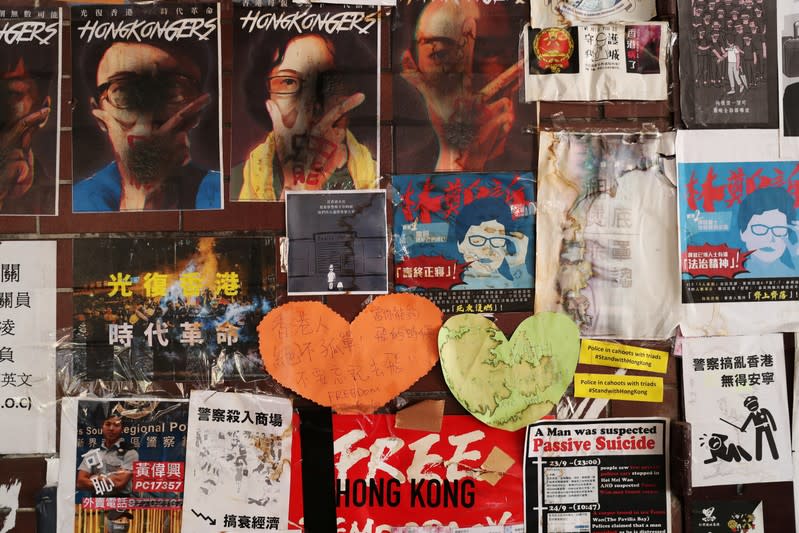 Posters and messages are seen on a wall in Hong Kong Polytechnic University (PolyU)