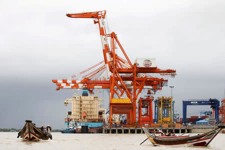 FILE PHOTO: A view shows the Myanmar industrial port terminal at the banks of the Hlaing river in Yangon, June 9, 2016. REUTERS/Soe Zeya Tun/File Photo