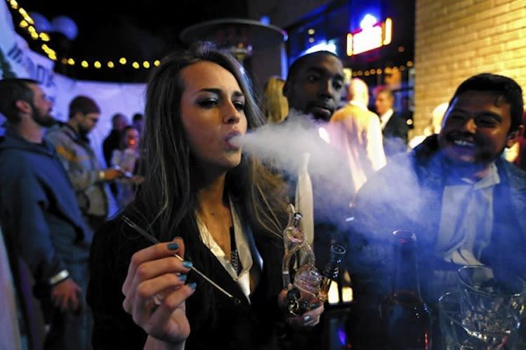 Patrons smoke marijuana at a Prohibition-themed New Year's Eve party in Denver -- Associated Press