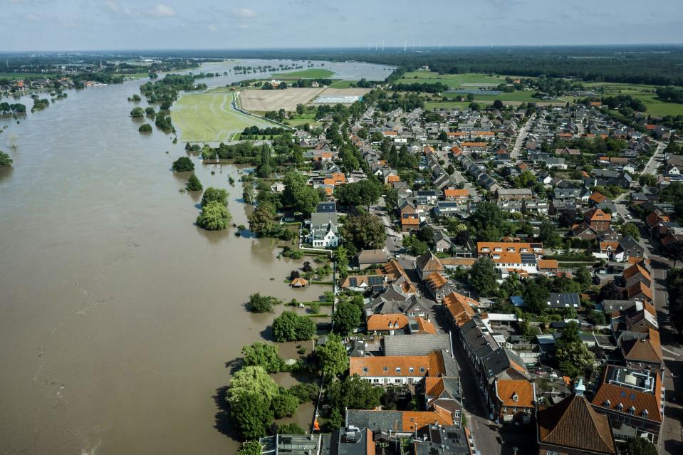 This aerial photograph taken above the Maas river shows the extend of the flood waters near the evacuated town of Arcen on 17 July 2021. - Troops and firefighters scrambled through the night July 17 to find victims of the devastation left by the worst floods to hit western Europe in decades, which have already left more than 150 people dead and dozens more missing. (Photo by Remko de Waal / ANP / AFP) / Netherlands OUT (Photo by REMKO DE WAAL/ANP/AFP via Getty Images)