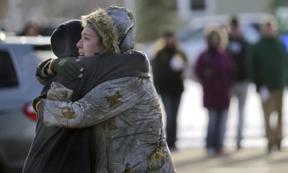 Sarah Rogstad, right, hugs Morgan Rogstad, grade 9, after the school shooting at Oshkosh West high school.