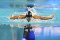 Torri Huske participates in the Women's 100 Butterfly during wave 2 of the U.S. Olympic Swim Trials on Sunday, June 13, 2021, in Omaha, Neb. (AP Photo/Charlie Neibergall)