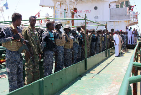 Maritime police are seen aboard oil tanker Aris-13, which was released by pirates, as it sails to dock on the shores of the Gulf of Aden in the city of Bosasso, northern Somalia's semi-autonomous region of Puntland, March 19, 2017. REUTERS/Abdiqani Hassan FOR EDITORIAL USE ONLY. NO RESALES. NO ARCHIVES