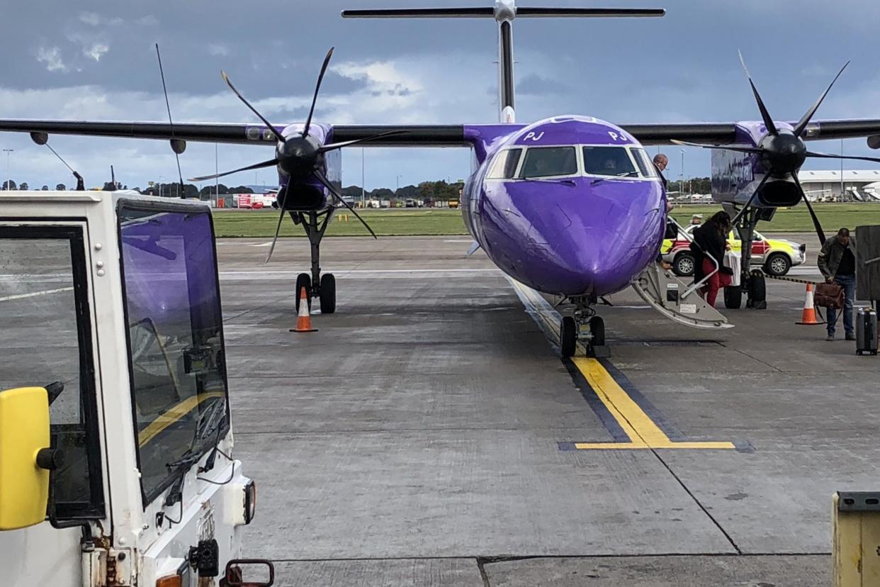 Purple patch: a Flybe Q400, just arrived at Edinburgh airport: Simon Calder