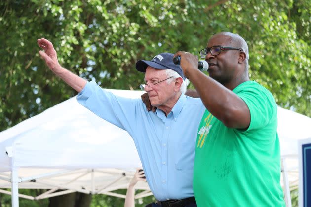 Sen. Bernie Sanders (I-Vt.), left, waves to supporters Friday as Rep. Jamaal Bowman (D-N.Y.) speaks during a reelection rally in Hastings-on-Hudson, New York.