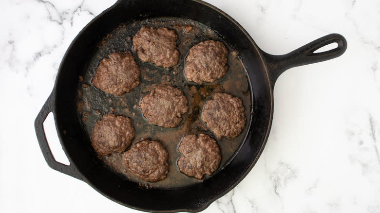 mini burgers in frying pan