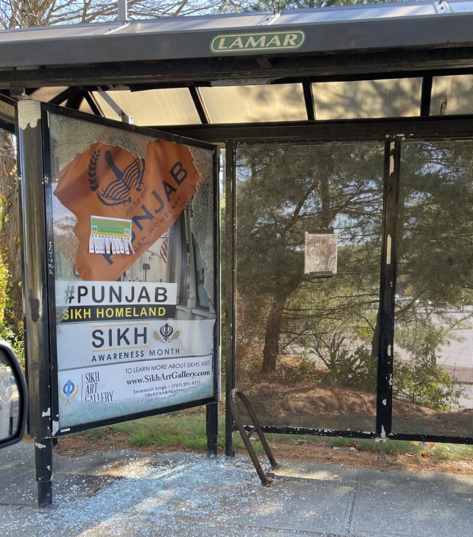 Smashed glass surrounds an advertisement placed by City Council Member Swaranjit Singh last month. The apparent vandalism was one of 4 incidents Singh reported among eight signs he places around the city.