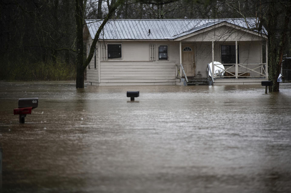 Homes along Alabama Street in Courtland sit in over a foot of water on Friday, Feb. 22, 2019, in Decatur, Ala. More than 30 school districts in Alabama, Mississippi and Tennessee closed Friday, in part because school buses couldn't navigate flooded roads. (Dan Busey/The Decatur Daily via AP)