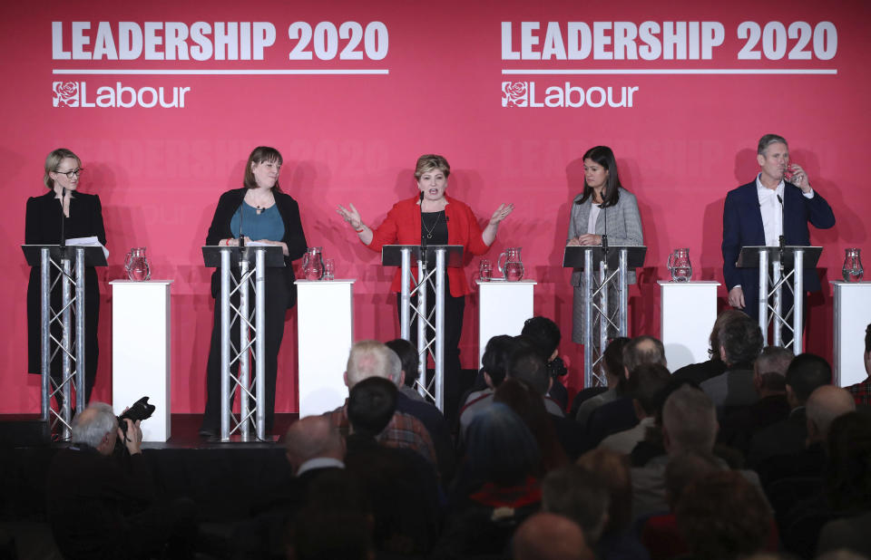 From left, Labour Members of Parliament, Rebecca Long-Bailey, Jess Phillips, Emily Thornberry, Lisa Nandy and Keir Starmer stand on the stage, during the first Labour leadership hustings at the ACC Liverpool, in Liverpool, England, Saturday, Jan. 18, 2020. (Danny Lawson/PA via AP)