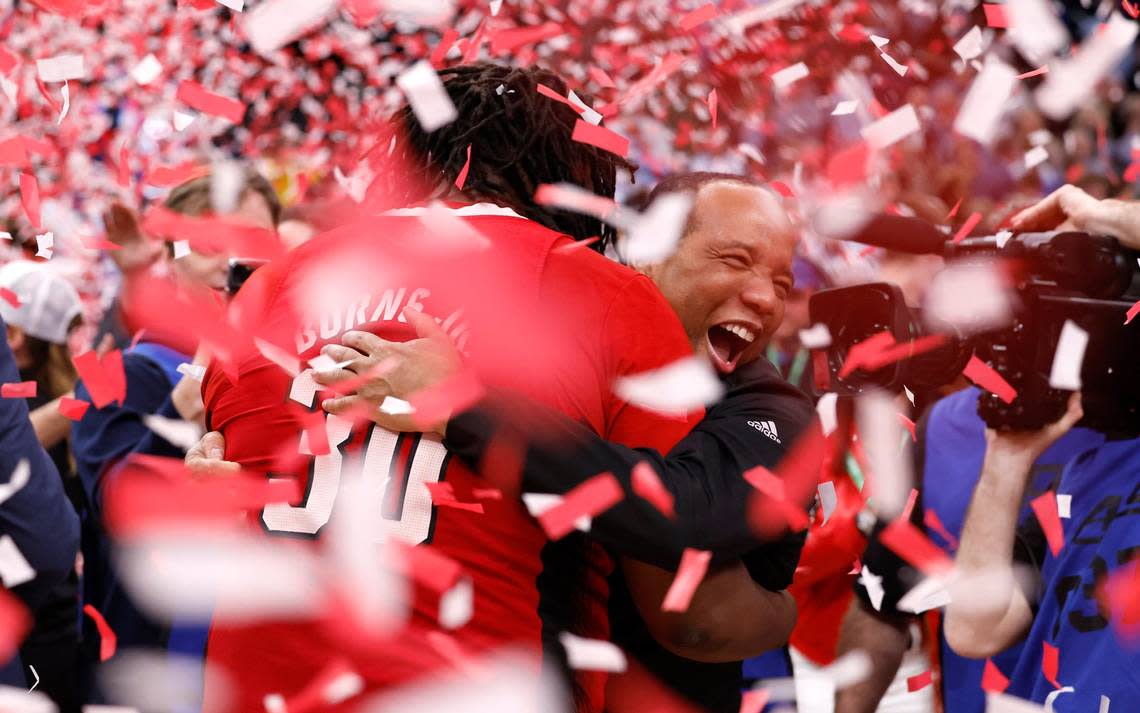 N.C. State’s head coach Kevin Keatts hugs DJ Burns Jr. (30) after N.C. State’s 84-76 victory over UNC in the championship game of the 2024 ACC Men’s Basketball Tournament at Capital One Arena in Washington, D.C., Saturday, March 16, 2024.