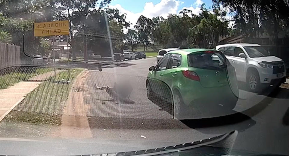 The boy bounces off the bonnet and appears to slam into the road head-first, with the impact sending both his shoes flying off his feet. Source: NSW Police