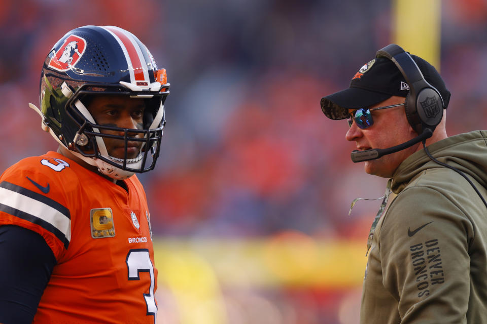 DENVER, COLORADO - NOVEMBER 20: Head coach Nathaniel Hackett of the Denver Broncos talks with Russell Wilson #3 of the Denver Broncos in the first quarter of a game against the Las Vegas Raiders at Empower Field At Mile High on November 20, 2022 in Denver, Colorado. (Photo by Justin Edmonds/Getty Images)