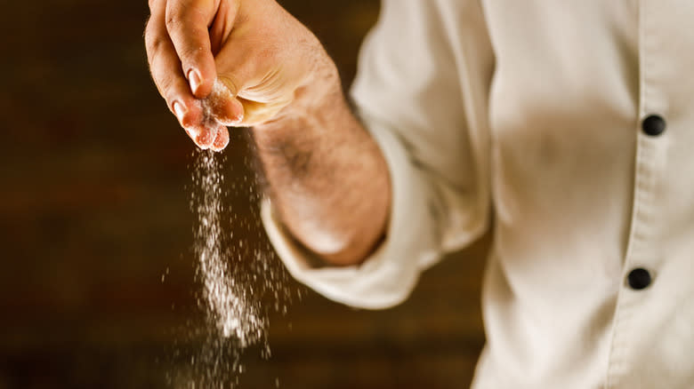 hand sprinkling salt