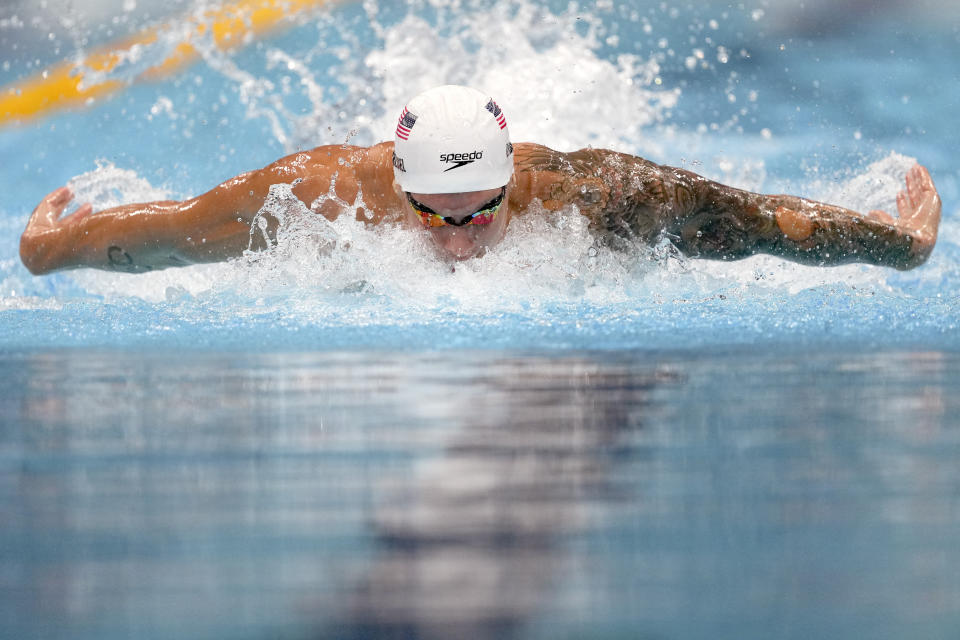 Caeleb Dressel of the United States swims in a heat of the men's 100-meter butterfly at the 2020 Summer Olympics, Thursday, July 29, 2021, in Tokyo, Japan. (AP Photo/Matthias Schrader)