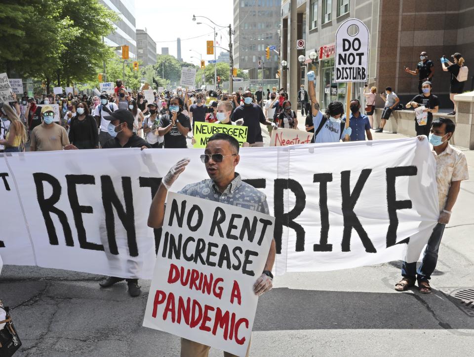 TORONTO, ON - JUNE 9: Several hundred people came out to protest on the Lawn of Queens Park before making their way to the Landlord and Tenant Board offices nearby.The threat of mass eviction of tenants unable to pay rent during the COVID-19 crisis is sparking protest. Tenants will rally at Queens Park to demand a permanent ban on evictions for any tenant unable to pay rent during the months of the pandemic.        (Richard Lautens/Toronto Star via Getty Images)