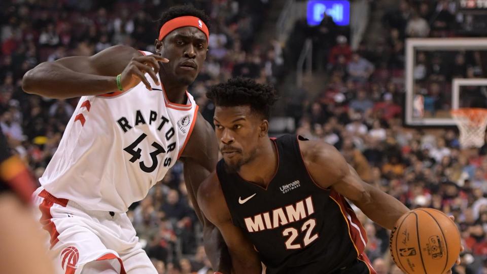 Dec 3, 2019; Toronto, Ontario, CAN;  Miami Heat forward Jimmy Butler (22) drives to the basket as Toronto Raptors forward Pascal Siakam (43) defends in the first half at Scotiabank Arena. Mandatory Credit: Dan Hamilton-USA TODAY Sports