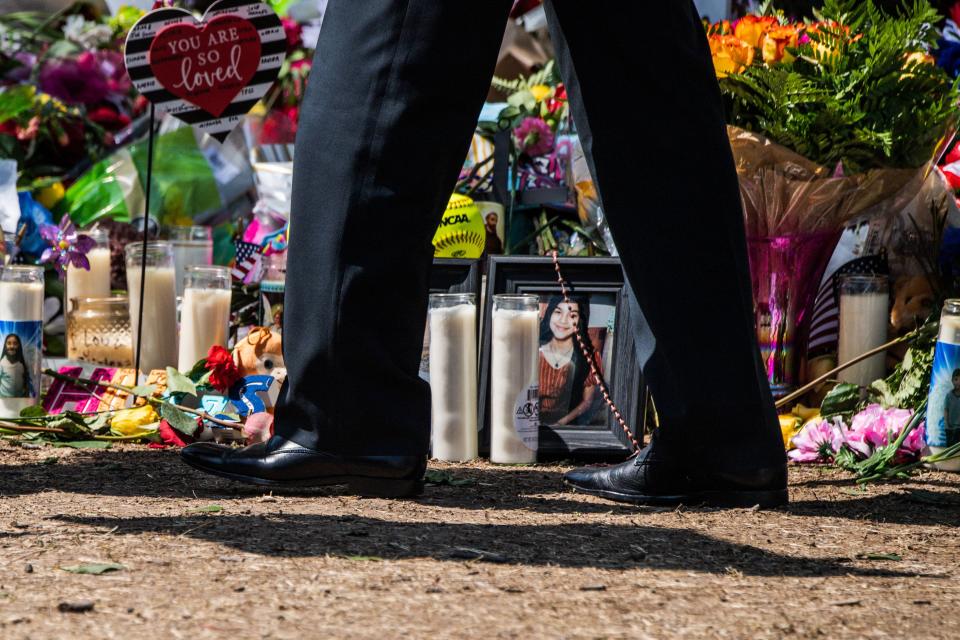 President Joe Biden pays respect at a makeshift memorial outside of Robb Elementary School in Uvalde, Texas.