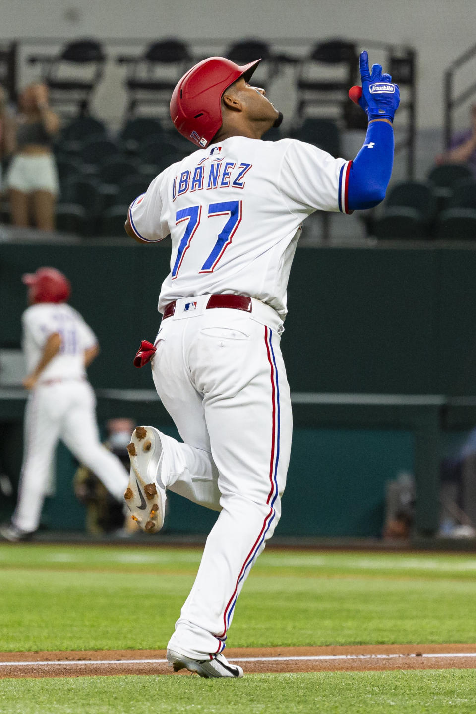 Texas Rangers' Andy Ibáñez (77) celebrates after hitting a home run during the first inning of a baseball game against the Oakland Athletics, Monday, June 21, 2021, in Arlington, Texas. (AP Photo/Sam Hodde)