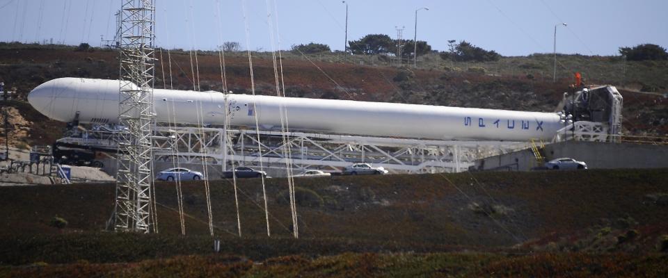 A SpaceX upgraded Falcon 9 rocket undergoes launch preparations at Vandenberg Air Force Base in California September 27, 2013. Privately owned Space Exploration Technologies plans to test an upgraded Falcon 9 rocket on Sunday from a site in California as part of its push into the satellite launch market. Perched on top of the 22-story, beefed-up Falcon 9 will be Canada�s Cassiope science satellite. Liftoff is targeted for 9 a.m. PDT (1600 GMT). �This is essentially a development flight for the rocket,� company founder and chief executive Elon Musk told Reuters. REUTERS/Gene Blevins (UNITED STATES - Tags: SCIENCE TECHNOLOGY BUSINESS)