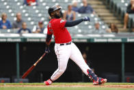 Cleveland Guardians' Franmil Reyes hits an RBI sacrifice fly against the Cincinnati Reds during the second inning of a baseball game, Thursday, May 19, 2022, in Cleveland. (AP Photo/Ron Schwane)