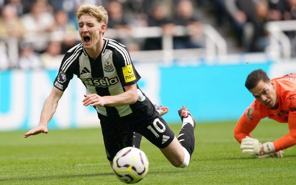 Newcastle United's Anthony Gordon goes to ground after a foul by Manchester City goalkeeper Ederson resulting in a penalty during the Premier League match at St James' Park, Newcastle upon Tyne