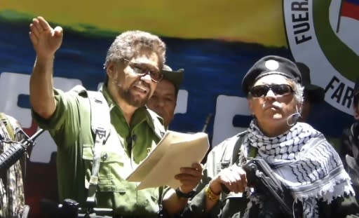 Former senior commander of the dissolved FARC rebel group Ivan Marquez (L) and fugitive rebel Jesus Santrich (R) are pictured in a video published on August 29, 2019 announcing their return to arms