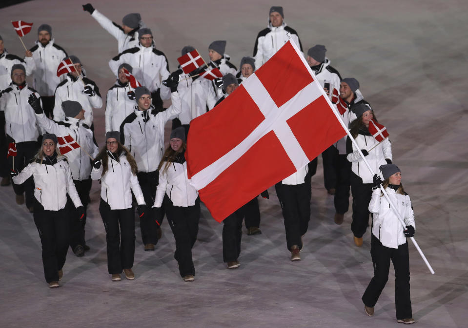 <p>Elena Moller Rigas carries the flag of Denmark during the opening ceremony of the 2018 Winter Olympics in Pyeongchang, South Korea, Friday, Feb. 9, 2018. (AP Photo/Michael Sohn) </p>