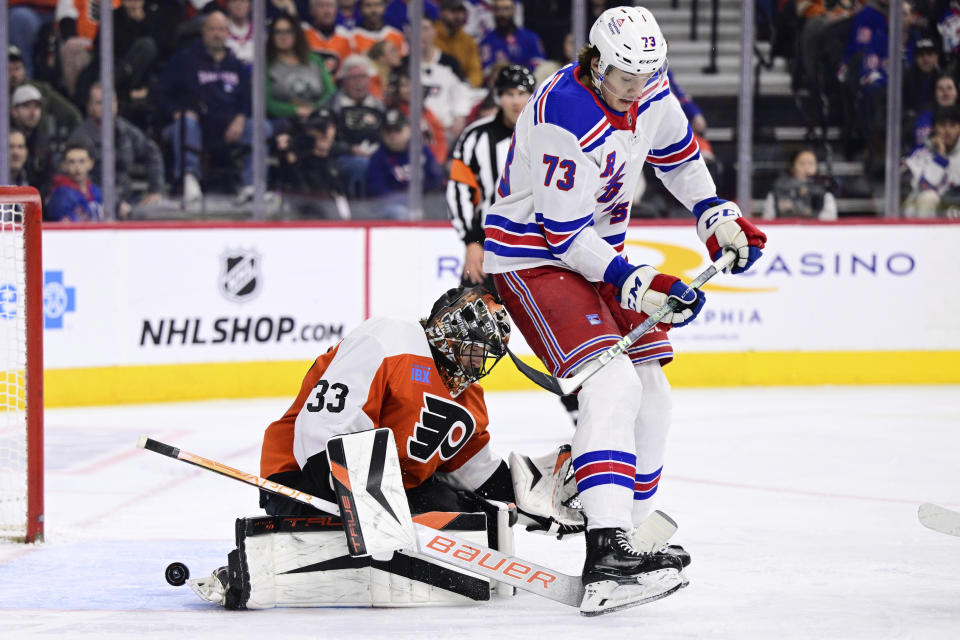 New York Rangers' Matt Rempe (73) scores past Philadelphia Flyers goaltender Samuel Ersson (33) during the third period of an NHL hockey game, Saturday, Feb. 24, 2024, in Philadelphia. (AP Photo/Derik Hamilton)