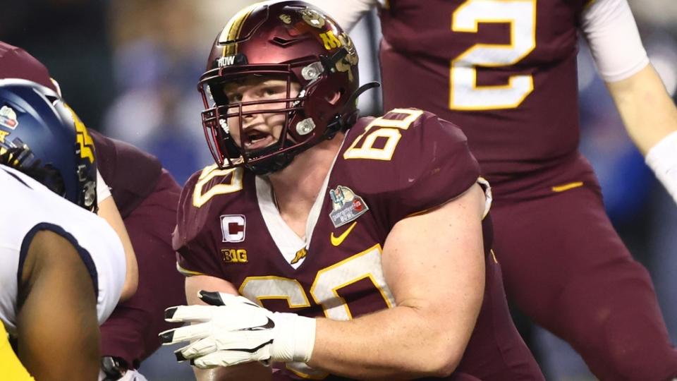 Dec 28, 2021; Phoenix, AZ, USA; Minnesota Golden Gophers center John Michael Schmitz (60) against the West Virginia Mountaineers in the Guaranteed Rate Bowl at Chase Field.