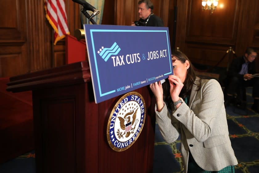 WASHINGTON, DC - NOVEMBER 16: Paige Waltz, digital media coordinator for Speaker of the House Paul Ryan (R-WI) prepares signage as the House votes on the Tax Cuts and Jobs Act in the Rayburn Room at the U.S. Capitol November 16, 2017 in Washington, DC. The House is poised to pass tax reform legislation, moving them one step closer to a promised tax cut for corporations and some individual Americans before the end of the year. (Photo by Chip Somodevilla/Getty Images) ** OUTS - ELSENT, FPG, CM - OUTS * NM, PH, VA if sourced by CT, LA or MoD **