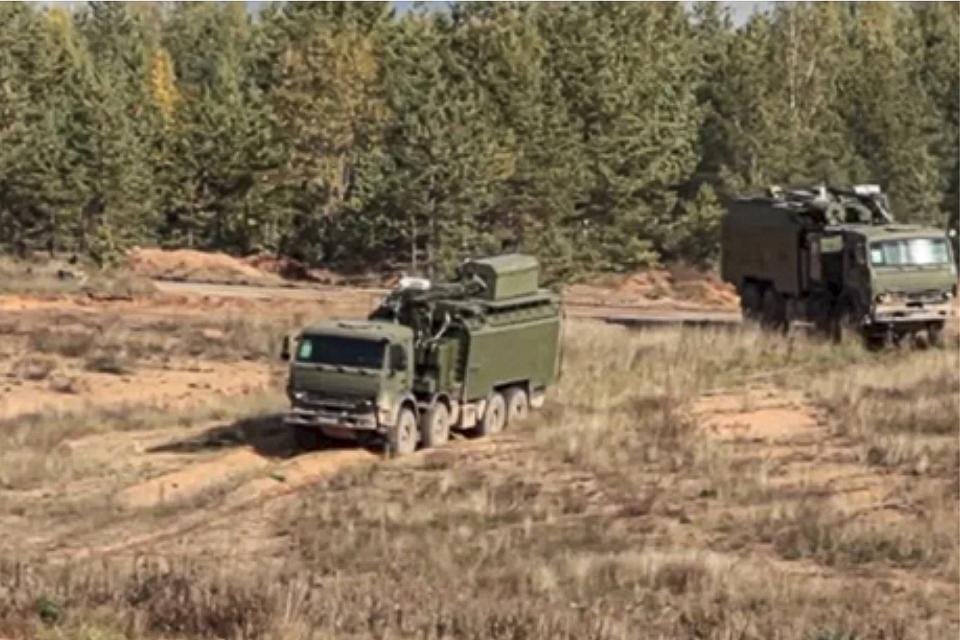 In this handout photo provided by Russian Defense Ministry Press Service Oct. 8, 2021, Crews of the Palantin complexes of a separate electronic warfare battalion of the combined arms army of the Western Military District during a special exercise drive at the Pogonovo training ground in Russia. (Russian Defense Ministry Press Service via AP)