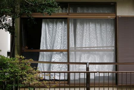 A window is seen at the home of a man, who went on a deadly attack at a facility for the disabled, near the facility in Sagamihara, Kanagawa prefecture, Japan, July 26, 2016. REUTERS/Issei Kato