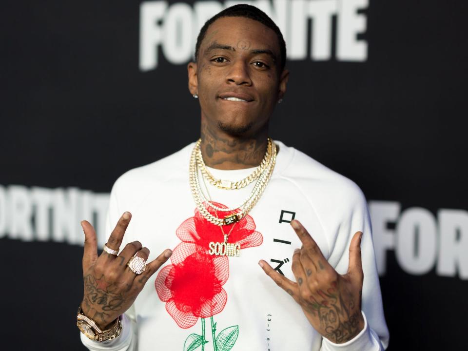 Soulja Boy and his hand tattoos done by Kat Von D.