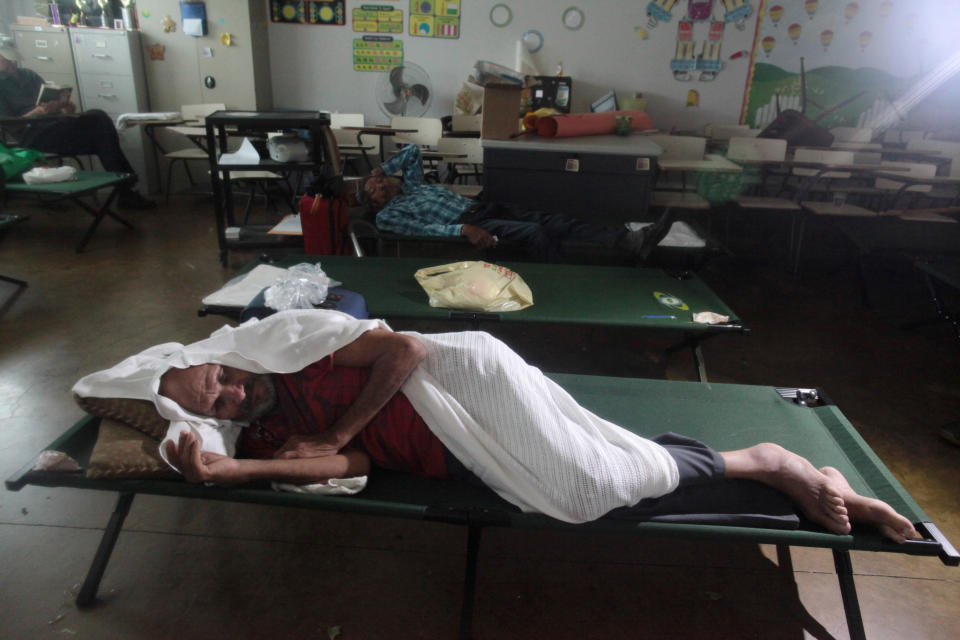 <p>People take shelter in a school as Hurricane Irma slammed across islands in the northern Caribbean on Wednesday, in Fajardo, Puerto Rico, Sept. 6, 2017. (Photo: Alvin Baez/Reuters) </p>