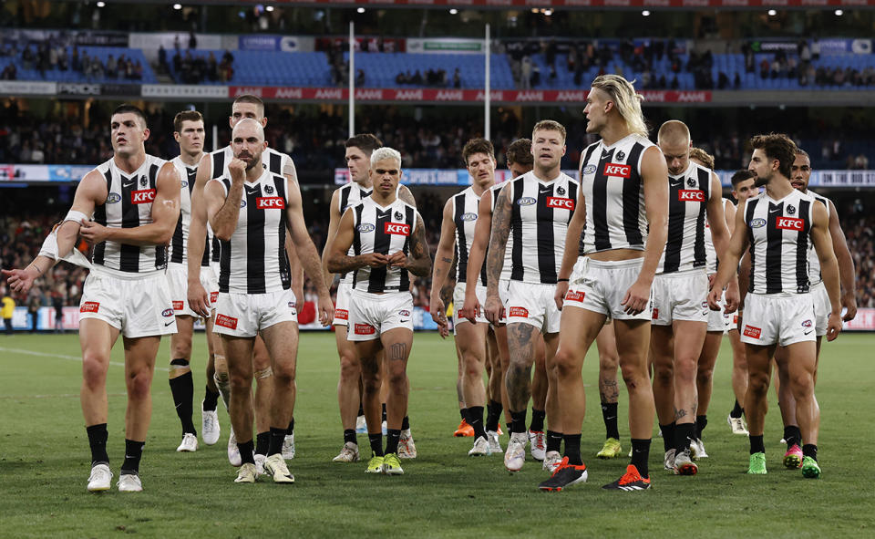 Collingwood players look on after their loss to St Kilda.