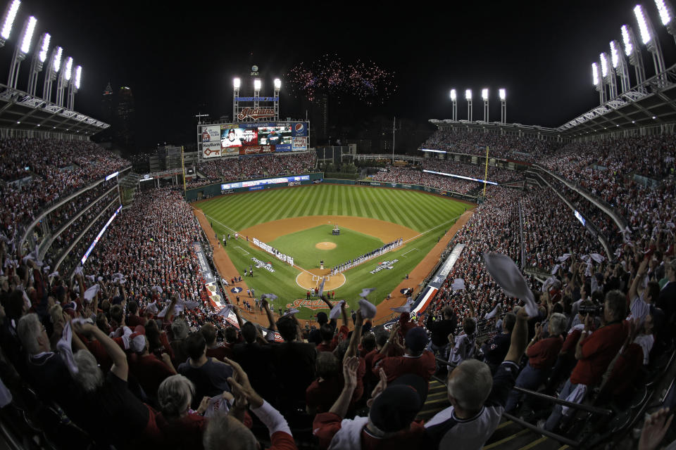 FILE - In this Oct. 2, 2013 file photo, fans in the upper deck wave towels as the Cleveland Indians and the Tampa Bay Rays are introduced for the AL wild-card baseball game at Progressive Field in Cleveland. The Cleveland Indians have agreed to a 15-year lease extension at Progressive Field, keeping them at their downtown ballpark through 2036 and ending speculation the franchise would relocate. The agreement, which was announced Thursday, Aug. 5, 2021, and still needs legislative approval, includes two additional five-year options that could make it a 25-year deal through 2046. (AP Photo/Mark Duncan, File)