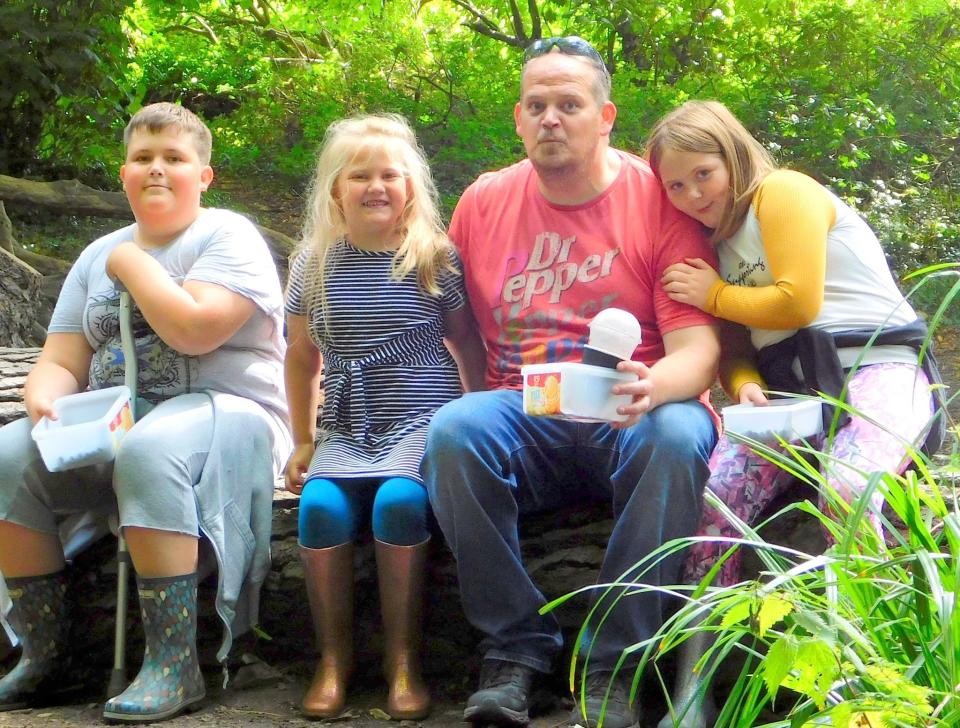 Jan Luscombe and his three children, who along with his wife Tara, face an uncertain future after being evicted from their home for a second time (Pic: Sue Ellery-Hill)