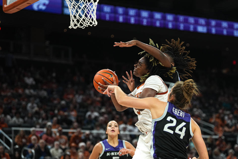 Texas forward DeYona Gaston tries to go up for a shot against Kansas State defenders during their game on Dec. 31 at Moody Center. Gaston, who once was one of the nation's top recruits, has been on a real tear lately in Big 12 play.