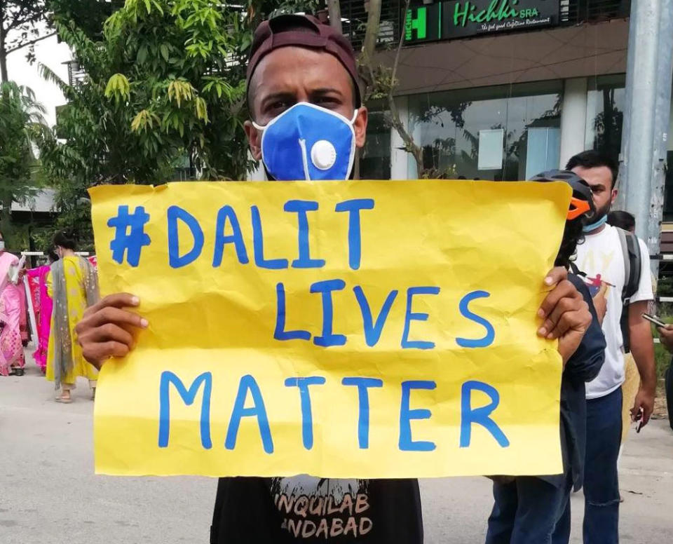 A protester holds a sign reading "Dalit Lives Matter" at a protest against the Hathras gang rape, in Guwahati, Assam, India on October 3, 2020.<span class="copyright">David Talukdar—NurPhoto/Getty Images</span>