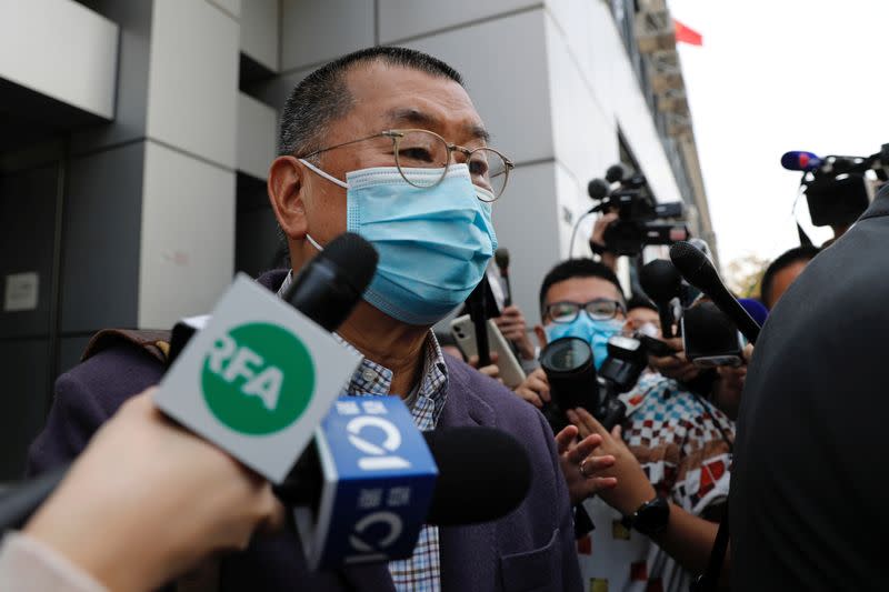 Media mogul and Apple Daily founder Jimmy Lai Chee-ying leaves from a police station after being arrested for illegal assembly during the anti-government protests in Hong Kong