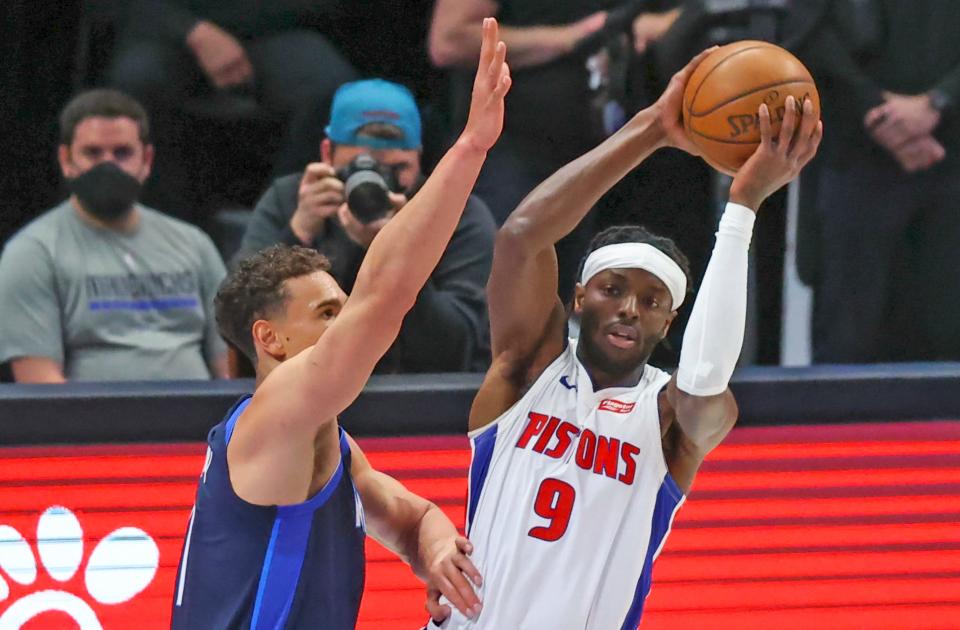 Detroit Pistons forward Jerami Grant (9) looks to pass as Dallas Mavericks center Dwight Powell (7) defends during the first quarter at American Airlines Center in Dallas on Wednesday, April 21, 2021.