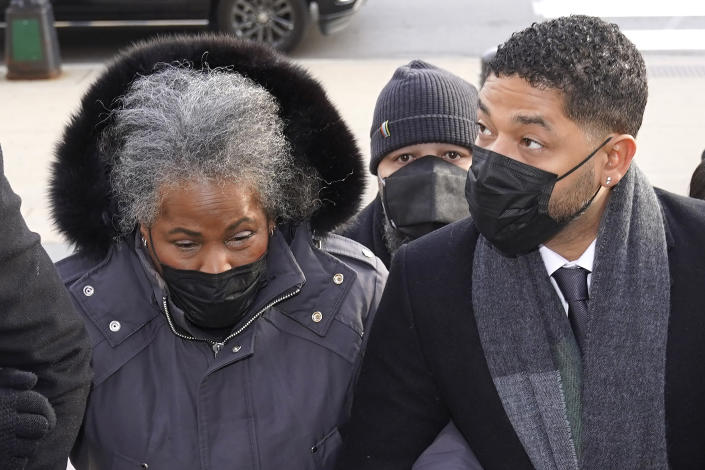 Actor Jussie Smollett arrives Tuesday, Dec. 7, 2021, with his mother Janet, at the Leighton Criminal Courthouse for day six of his trial in Chicago. Smollett is accused of lying to police when he reported he was the victim of a racist, anti-gay attack in downtown Chicago nearly three years ago, in Chicago. (AP Photo/Charles Rex Arbogast)