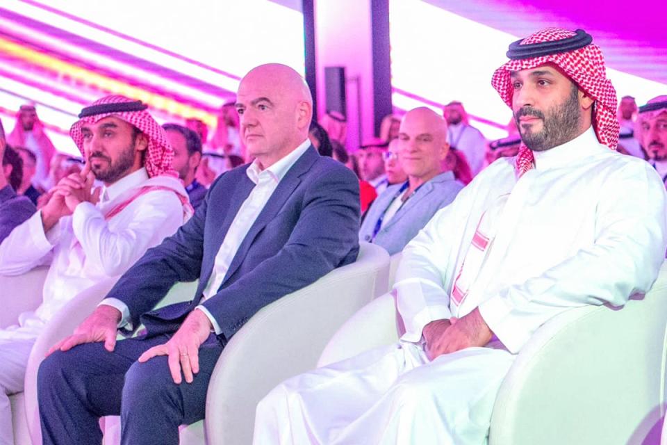Fifa president Gianni Infantino (centre) with Crown Prince Mohammed bin Salman (right) in Riyadh last month. Saudi Arabia has been awarded the 2034 World Cup (SPA/AFP/Getty)