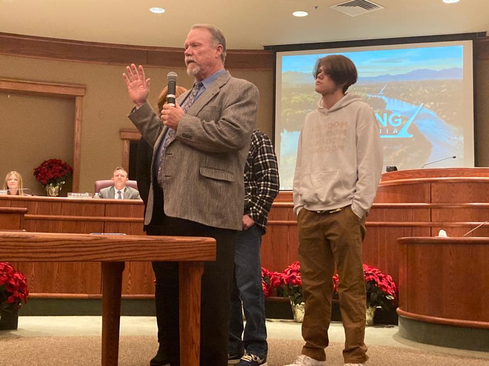Jack Munns, with this family behind him, takes the oath of office at the Tuesday, Dec. 6, 2022, Redding City Council meeting.