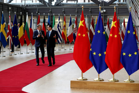 Chinese Premier Li Keqiang and European Council President Donald Tusk walk ahead of a EU-China summit in Brussels, Belgium April 9, 2019. REUTERS/Yves Herman