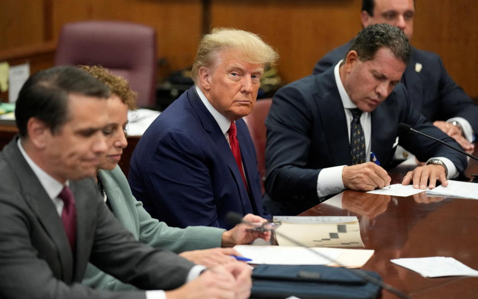 Donald Trump in a Manhattan courtroom with members of his legal team.