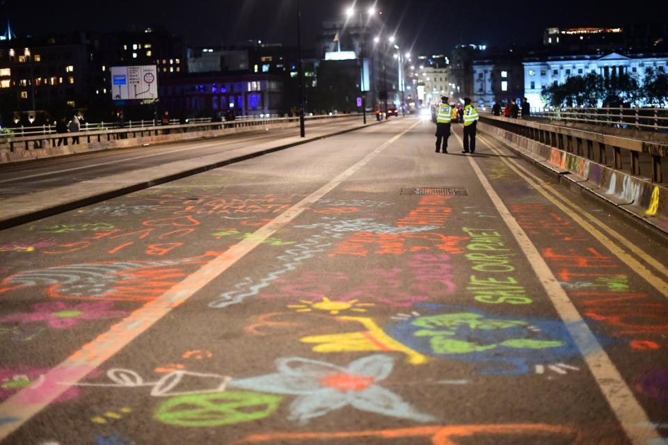 Police removed Extinction Rebellion demonstrators from Waterloo Bridge on Sunday (Victoria Jones/PA)