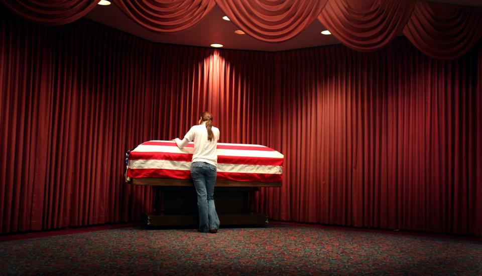 "I expected when I touched his coffin I would feel some sort of a connection," says Kristen Nelson, on the first time that she touched the casket of her husband, Cpl. Ricky Nelson, on April 22, 2008, at Proko Funeral Home in Kenosha. "The first time I touched it, I felt nothing, because he's not there. It's just an empty feeling knowing that he's not here with us at all. It was just a horrible feeling." Ricky Nelson was killed eight days earlier by a roadside bomb in Iraq during his second tour of duty with the Marine Reserve Fox Company unit.